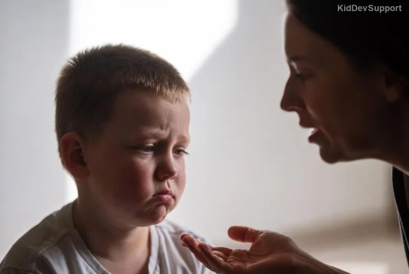 Happy child with ASD communicating during PRT session