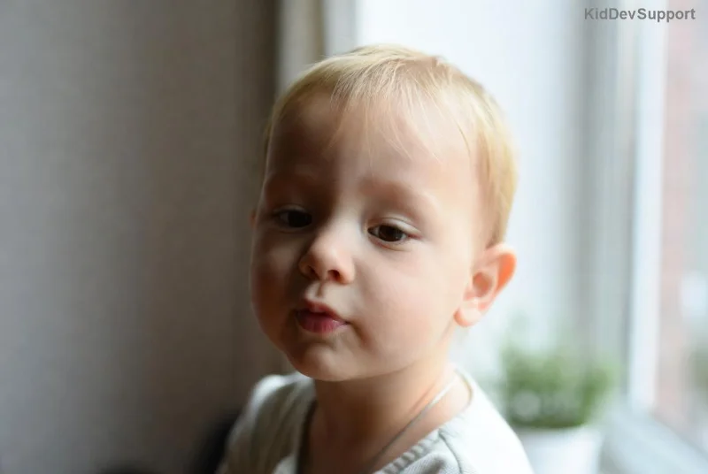 Therapist working with young child on developmental skills