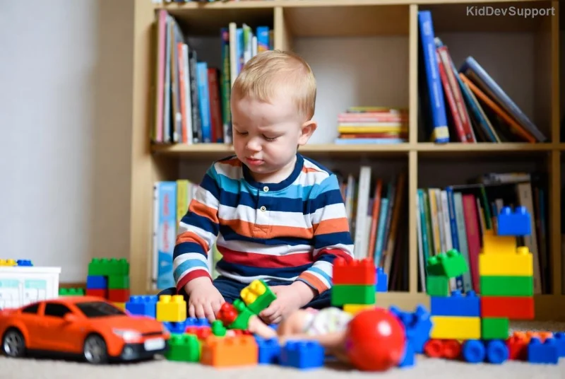 Child playing with toys showing speech delay signs